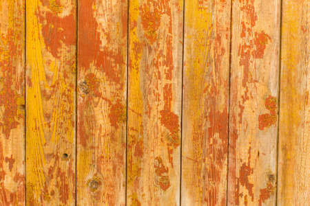 Peeling paint on old wooden rustic material on the wall. Wood texture backgrounds.の写真素材