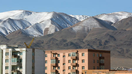 View of Olgii city, houses, mountains in the background, Bayan-Olgii Aimag (province) of Mongolia.の写真素材
