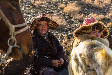 OLGIY, MONGOLIA - SEP 30, 2017: Kazakh Golden Eagle Hunter at traditional clothing of West Mongolia.のeditorial素材