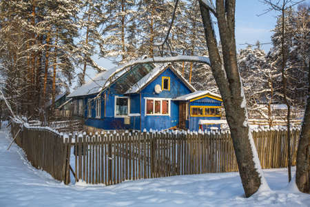 Typical houses in the urban-type settlement in Leningrad oblast at winter, Russia.の写真素材