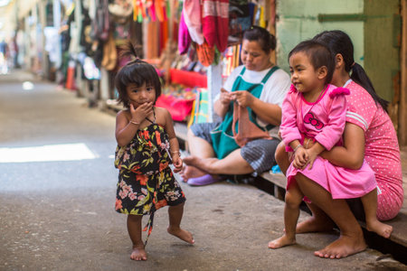 KO CHANG, THAILAND - FEB 15, 2018: Local inhabitants of the Bang Bao fishing village, which consists of houses on stilts built into the sea. Ko Chang consisting of 8 villages with 5,356 inhabitants.のeditorial素材