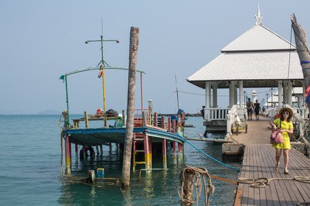 KO CHANG, THAILAND - FEB 18, 2018: Sunken ship near pier of Bang Bao fishing village, which consists of houses on stilts built into the sea. Ko Chang consisting of 8 villages with 5,356 inhabitants.のeditorial素材