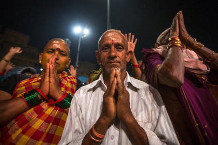 VARANASI, INDIA - MAR 15, 2018: Pilgrims during perform Agni Pooja (Sanskrit: Worship of Fire) on...
