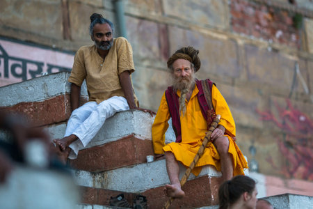 VARANASI, INDIA - MAR 17, 2018: Sadhu (holy man) on the ghats of Ganga river. Varanasi is most important pilgrimage sites in India, one of the 7 sacred cities of Hinduism.のeditorial素材