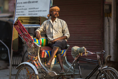 VARANASI, INDIA - MAR 23, 2018: Indian trishaw waiting passengers on the street. According to legends, the city was founded by God Shiva about 5000 years ago.のeditorial素材