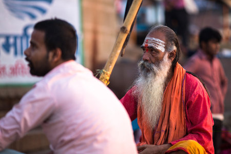 VARANASI, INDIA - MAR 19, 2018: Sadhu or Baba (holy man) on the ghats of Ganges river. Normally a sadhu is a monk, renounced, renounced material enjoyment. In India from 4 to 5 million sadhu.のeditorial素材