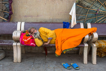 VARANASI, INDIA - MAR 16, 2018: Hindu sadhu on the ghats of the Ganges river. According to legends, the city was founded by God Shiva about 5000 years ago.のeditorial素材