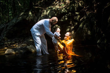 KOH CHANG, THAILAND - MAR 10, 2018: During Christian sacrament of spiritual birth - Baptism. There are currently 10 Orthodox parishes in Thailand, Orthodoxy is practiced by 0.002% of population.のeditorial素材