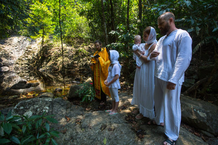 KOH CHANG, THAILAND - MAR 10, 2018: During Baptism - Christian sacrament of spiritual birth. There...