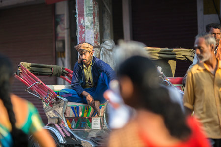 VARANASI, INDIA - MAR 23, 2018: Indian trishaw waiting passengers on the street. According to...