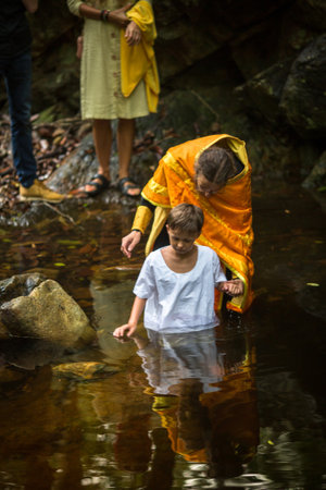 KOH CHANG, THAILAND - MAR 9, 2018: During Christian sacrament of spiritual birth - Baptism. There are currently 10 Orthodox parishes in Thailand, Orthodoxy is practiced by 0.002% of population.のeditorial素材