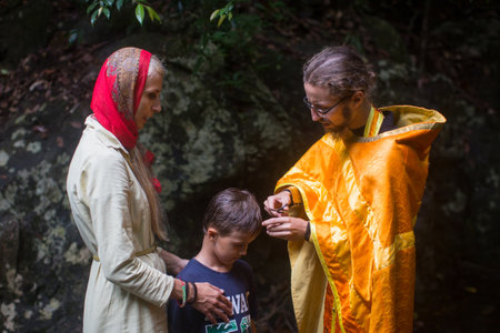 KOH CHANG, THAILAND - MAR 9, 2018: During Christian sacrament of spiritual birth - Baptism. There are currently 10 Orthodox parishes in Thailand, Orthodoxy is practiced by 0.002% of population.のeditorial素材