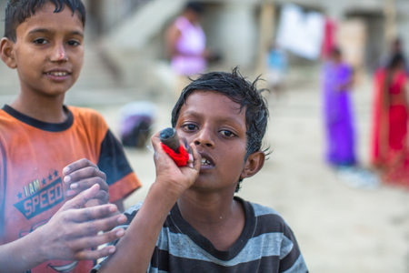 VARANASI, INDIA - MAR 16, 2018: Unidentified indian street children on the banks of Ganga river. According to legends, the city was founded by God Shiva about 5000 years ago.のeditorial素材