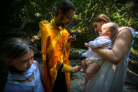 KOH CHANG, THAILAND - MAR 10, 2018: During rites Baptism (immersion in water) - the first and most...