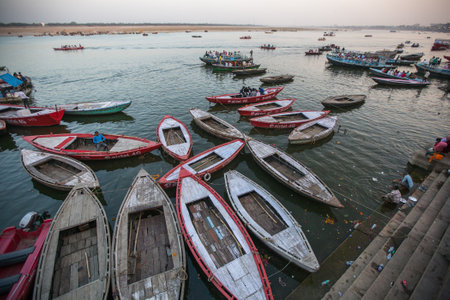 VARANASI, INDIA - MAR 17, 2018: Banks on the holy Ganges river. According to legends, the city was...