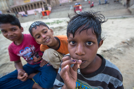 VARANASI, INDIA - MAR 16, 2018: Unidentified indian street children on the banks of Ganga river. According to legends, the city was founded by God Shiva about 5000 years ago.のeditorial素材
