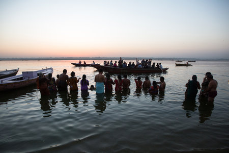 VARANASI, INDIA - MAR 19, 2018: Banks on the holy Ganges river in the early morning. According to legends, the city was founded by God Shiva about 5000 years ago.のeditorial素材