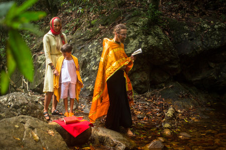 KOH CHANG, THAILAND - MAR 9, 2018: During Christian sacrament of spiritual birth - Baptism. There are currently 10 Orthodox parishes in Thailand, Orthodoxy is practiced by 0.002% of population.のeditorial素材