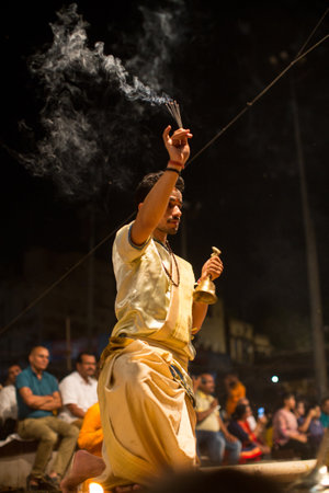 VARANASI, INDIA - MAR 23, 2018: Hindu priests perform Agni Pooja (Sanskrit: Worship of Fire) on Dashashwamedh Ghat - main and oldest ghat of Varanasi located on the Ganges.のeditorial素材