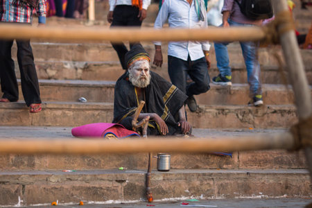 VARANASI, INDIA - MAR 21, 2018: Sadhu or Baba (holy man) on the ghats of Ganges river. Normally a sadhu is a monk, renounced, renounced material enjoyment. In India from 4 to 5 million sadhu.のeditorial素材