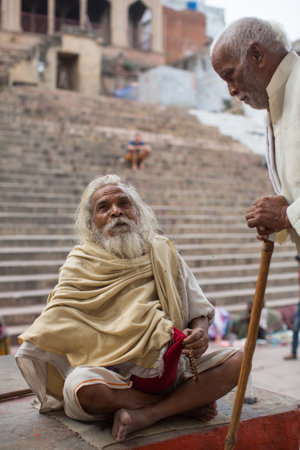 VARANASI, INDIA - MAR 15, 2018: Sadhu (holy man) on Dashashwamedh Ghat is the main and probably oldest ghat of Varanasi located on the Ganges, close to Kashi Vishwanath Temple.のeditorial素材