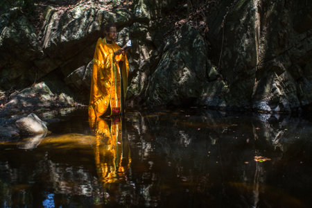 KOH CHANG, THAILAND - MAR 10, 2018: During Christian sacrament of spiritual birth - Baptism. There are currently 10 Orthodox parishes in Thailand, Orthodoxy is practiced by 0.002% of population.のeditorial素材
