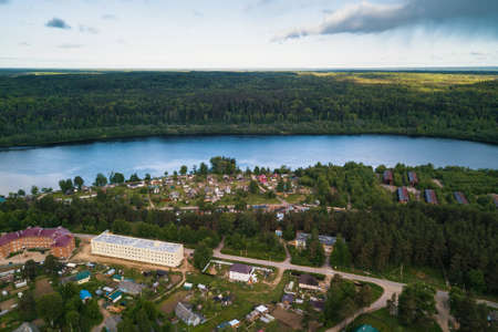 Svir river and summer green forests of Leningrad region, Russia. Bird's eye view of an urban-type...