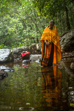 KOH CHANG, THAILAND - MAR 9, 2018: Orthodox priest during sacrament of spiritual birth - Baptism. There are currently 10 Orthodox parishes in Thailand, Orthodoxy is practiced by 0.002% of population.のeditorial素材