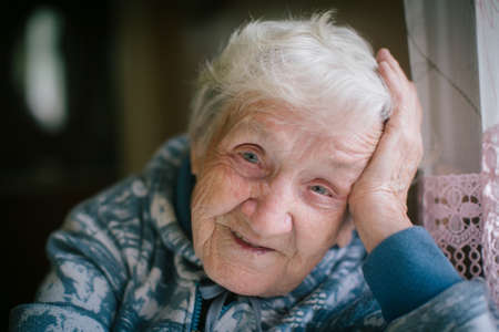 Portrait of a happy elderly woman close-up. Age 90 years old.の写真素材