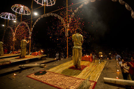 VARANASI, INDIA - MAR 15, 2018: Group of priests perform Agni Pooja (Sanskrit- Worship of Fire) on Dashashwamedh Ghat - main and oldest ghat of Varanasi located on the Ganges.のeditorial素材