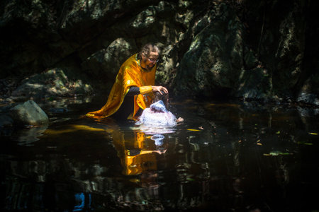 KOH CHANG, THAILAND - MAR 10, 2018: During rites Baptism (immersion in water) - the first and most important Christian sacrament. Currently Orthodoxy is practiced by 0.002% of population in Thailand.のeditorial素材