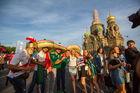 St.PETERSBURG, RUSSIA - JUN 27, 2018: Participants of the FIFA fans festival near Church of the Savior on Blood in the city center.のeditorial素材