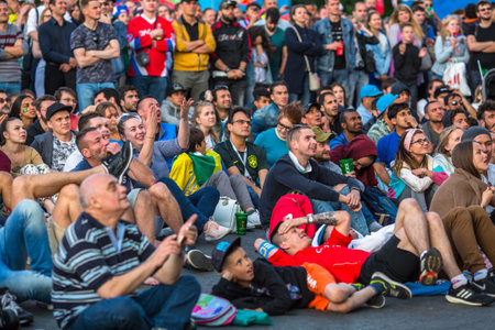 St.PETERSBURG, RUSSIA - JUN 27, 2018: Participants of the FIFA fans festival near Church of the Savior on Blood in the city center.のeditorial素材