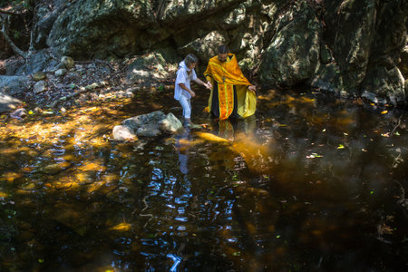 KOH CHANG, THAILAND - MAR 10, 2018: During rites Baptism (immersion in water) - the first and most important Christian sacrament. There are currently 10 Orthodox parishes in Thailand.のeditorial素材