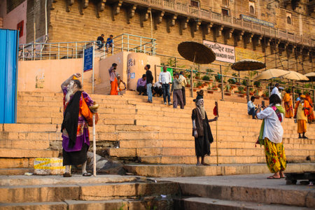 VARANASI, INDIA - MAR 21, 2018: Sadhu or Baba (holy man) on the ghats of Ganges river. Normally a sadhu is a monk, renounced, renounced material enjoyment. In India from 4 to 5 million sadhu.のeditorial素材