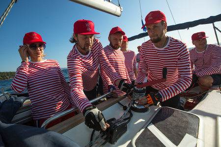 METHANA, GREECE - OCT 7, 2018: Sailors participate in sailing regatta 20th Ellada Autumn 2018 among Greek island group in the Aegean Sea, in Cyclades and Saronic Gulf.のeditorial素材
