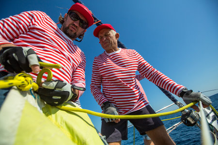 METHANA, GREECE - OCT 7, 2018: Sailors participate in sailing regatta 20th Ellada Autumn 2018 among Greek island group in the Aegean Sea, in Cyclades and Saronic Gulf.のeditorial素材