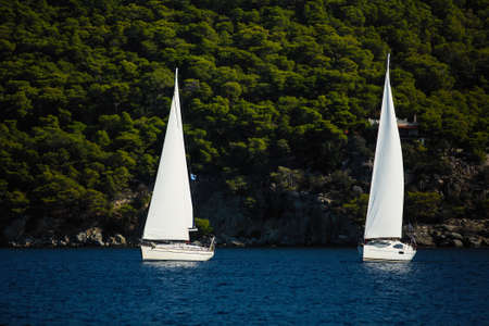 Sailing luxury yachts at Aegean Sea. Cruise yachting.