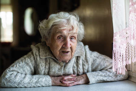 Gray-haired elderly woman portrait looking at the camera.の写真素材
