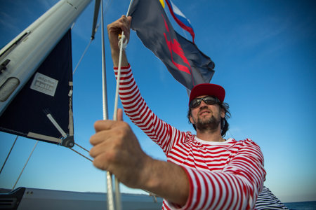 METHANA, GREECE - OCT 7, 2018: Sailors participate in sailing regatta 20th Ellada Autumn 2018 among Greek island group in the Aegean Sea, in Cyclades and Saronic Gulf.のeditorial素材