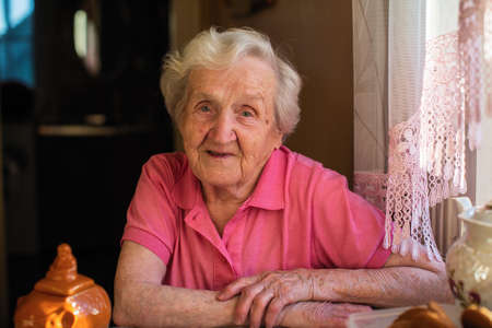 Portrait of an elderly woman in her home.の写真素材