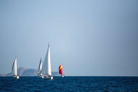 Luxury sailing boats participate in yacht regatta, Aegean Sea - Greece.