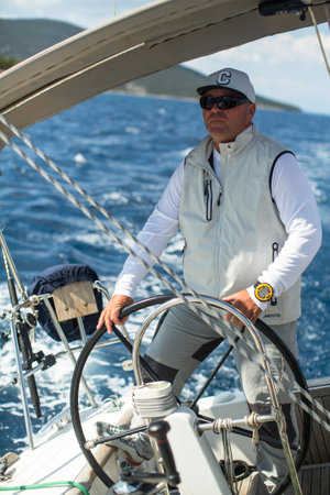 POROS, GREECE - OCT 9, 2018: Sailors participate in sailing regatta 20th Ellada Autumn 2018 among...