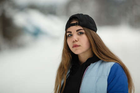 Teen girl closeup portrait outdoors in winter.