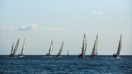 POROS, GREECE - OCT 10, 2018: Sailboat participate in sailing regatta 20th Ellada Autumn 2018 among Greek island group in the Aegean Sea, in Cyclades and Saronic Gulf.のeditorial素材