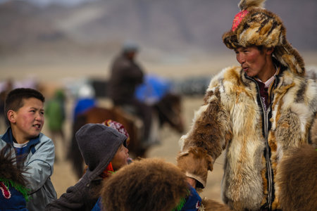 OLGIY, MONGOLIA - SEP 30, 2017: Local mongolian people during annual national competition with birds of prey BERKUTCHI of West Mongolia.のeditorial素材