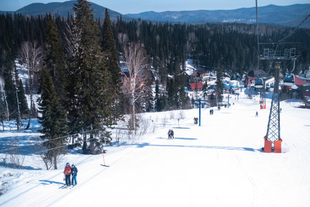 SHEREGESH, RUSSIA - MAR 10, 2019: View of the snow slope from the ski lift in the Mountain Shoria. It is now one of the most popular winter sports resort where more than million of tourist.のeditorial素材