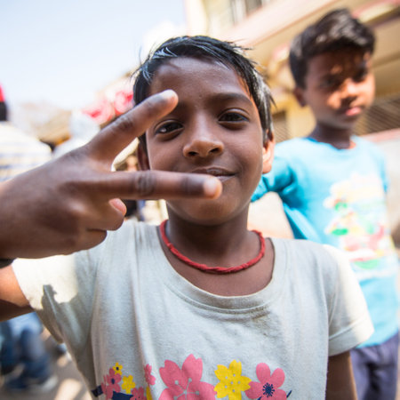 VARANASI, INDIA - MAR 14, 2018: Unidentified indian children on the banks of Ganga river. Varanasi is most important pilgrimage sites in India, one of the 7 sacred cities of Hinduism.のeditorial素材