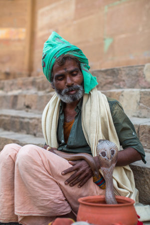 VARANASI, INDIA - MAR 14, 2018: Locals on the banks of Ganga river. Varanasi is most important pilgrimage sites in India, one of the 7 sacred cities of Hinduism, a Holy city for Buddhists and Jains.のeditorial素材