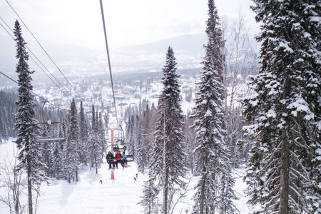 SHEREGESH, RUSSIA - MAR 18, 2019: View of the snow slope from the ski lift in the Mountain Shoria. It is now one of the most popular winter sports resort where more than million of tourist.のeditorial素材